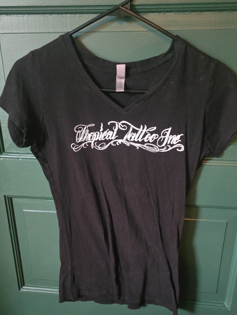 Next Level Apparel Black V-Neck Tee with White Script Logo